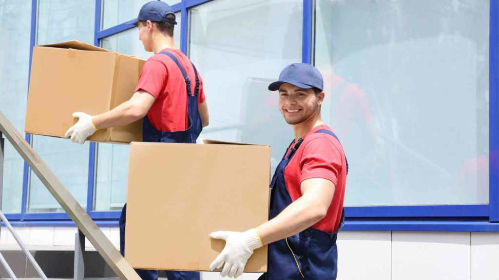 two workers smiley carrying boxes | The Moving Company Gold Coast