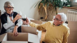 Older Couple Drinking Wine Together Biside the Boxes | The Moving Company Gold Coast